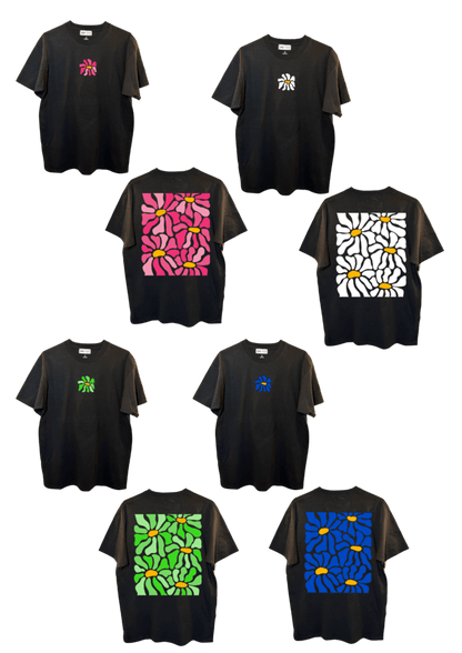 T-shirt oversize blanc, 100% coton. Personnalisation du t-shirt grâce à une technique de flocage, le DTF, pour une meilleure qualité d’impression et de tenue. La personnalisation est floquée au centre, en haut milieu et dans le dos. Ici, il s’agit des personnalisations de DTF fleur en rose, blanc, vert et bleu.