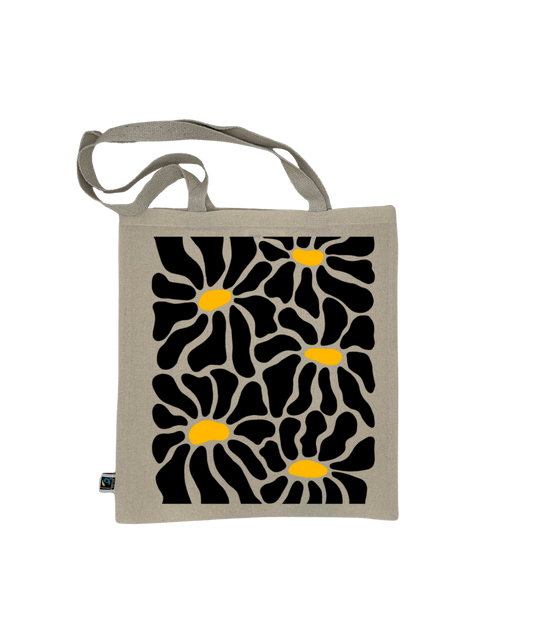 Tote bag, sac de course en coton. Personnalisation du débardeur grâce à une technique de flocage, le DTF, pour une meilleure qualité d’impression et de tenue. La personnalisation est floquée au centre, en haut milieu. Tout est fait à la commande selon la personnalisation choisie. Ici, il s’agit de la personnalisation de DTF, flocage fleur en noir. 